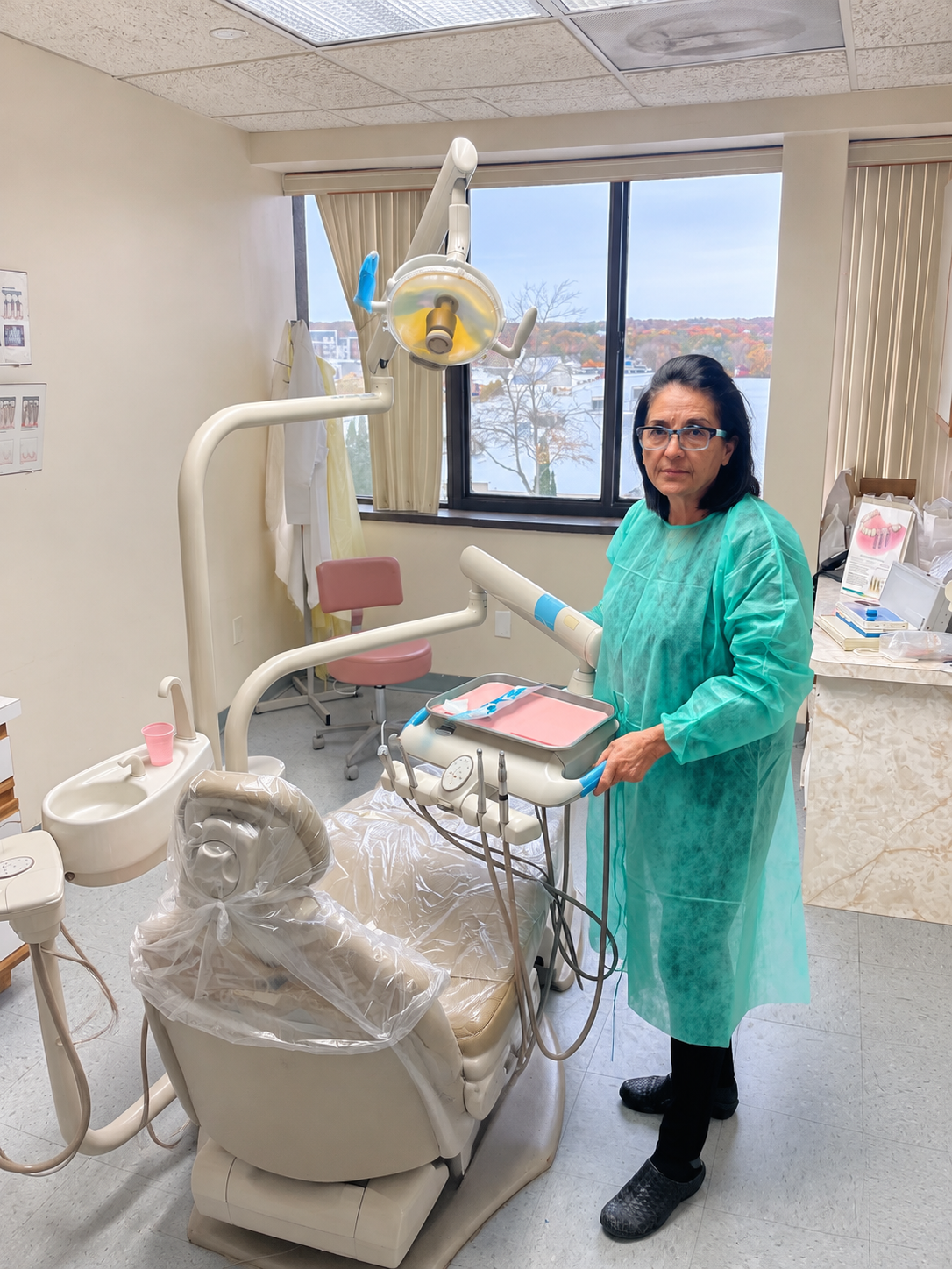 Dr. Forough Tabatabaie beside a dental chair at FT Dental’s Woburn office